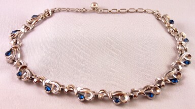SJ105 Trifari rhodium bow necklace w blue rhinestones